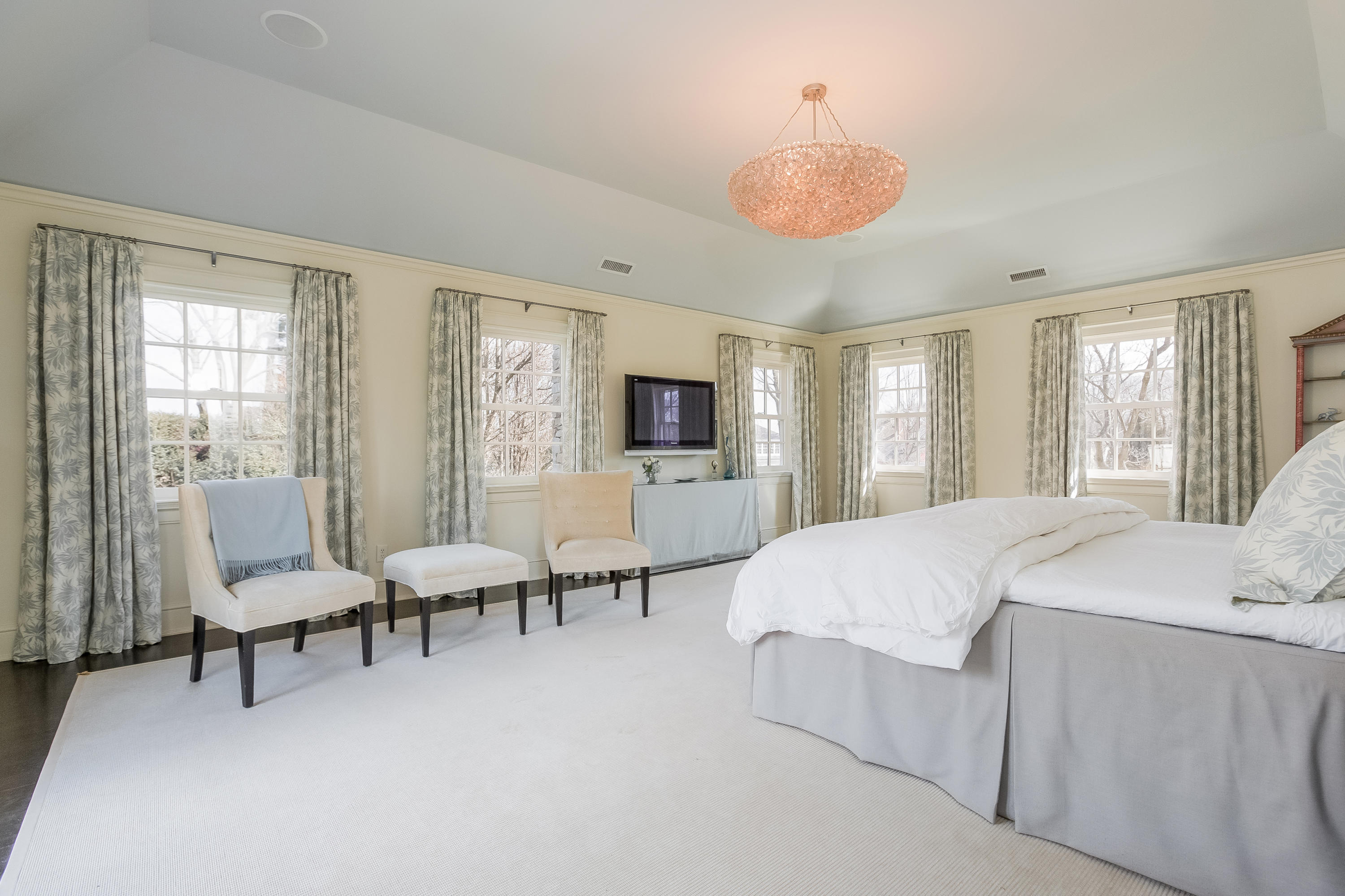 6 Davis Lane Darien, CT 06820 - Photo 24 of 49 a spacious bedroom with a bed and large windows