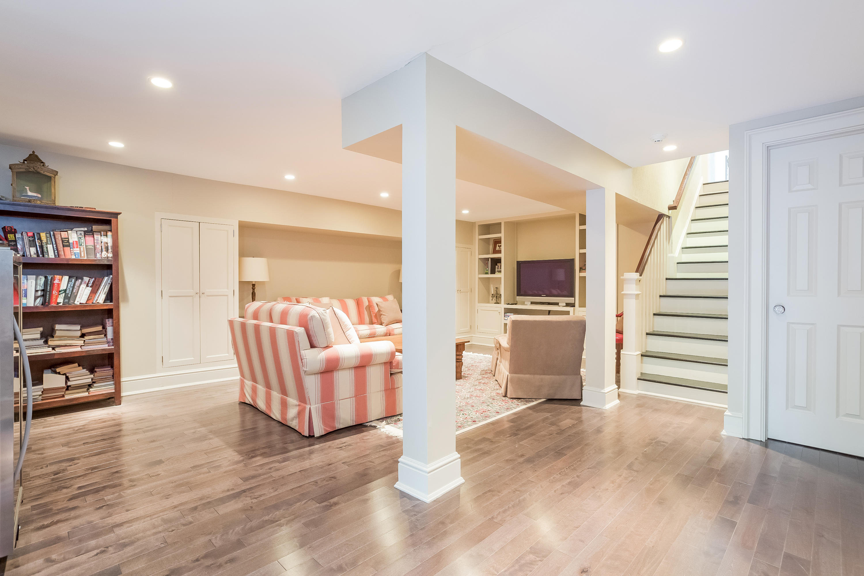 6 Davis Lane Darien, CT 06820 - Photo 32 of 49 a view of a livingroom with furniture and stairs