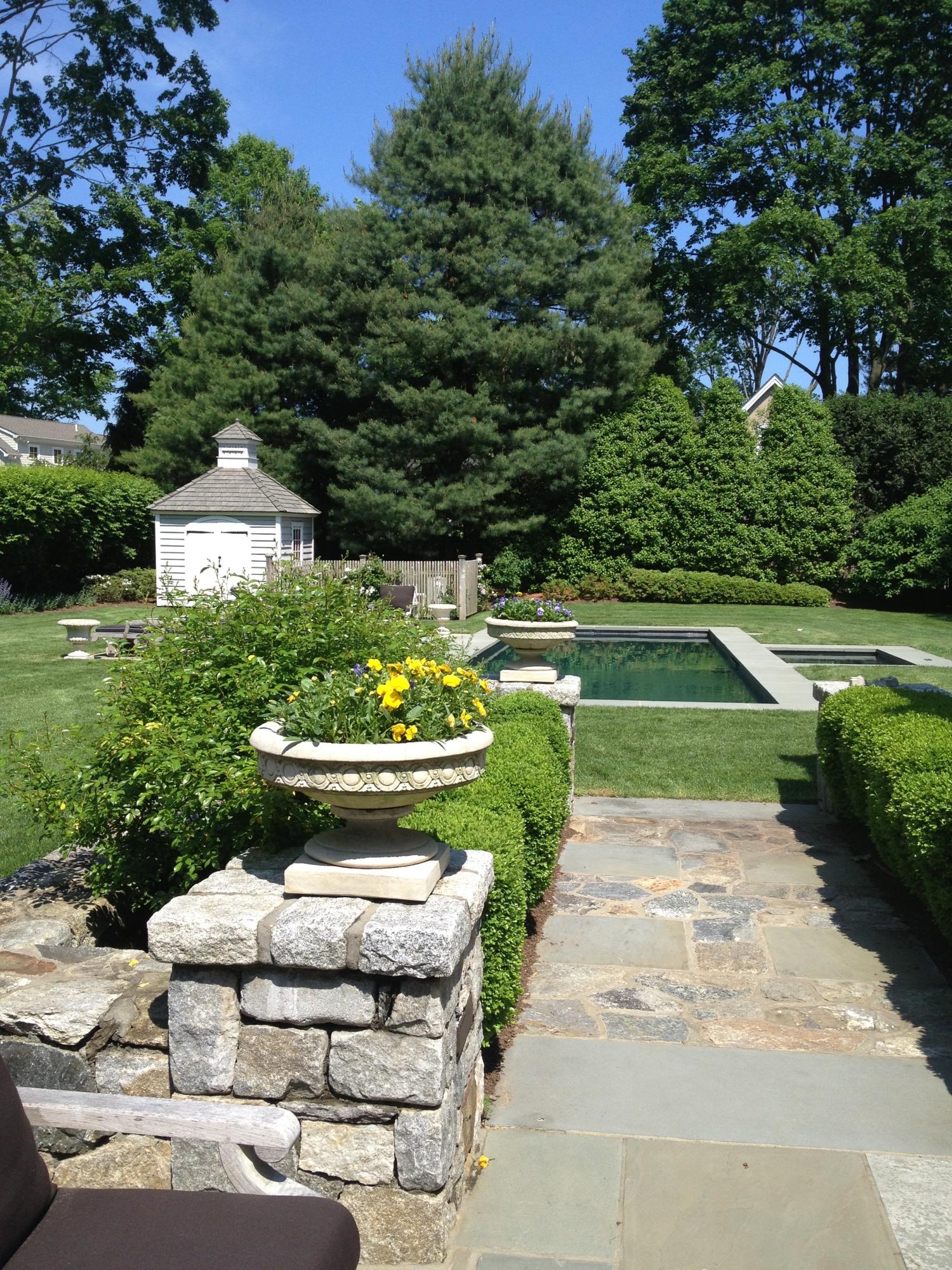6 Davis Lane Darien, CT 06820 - Photo 34 of 49 a view of a garden with a fountain