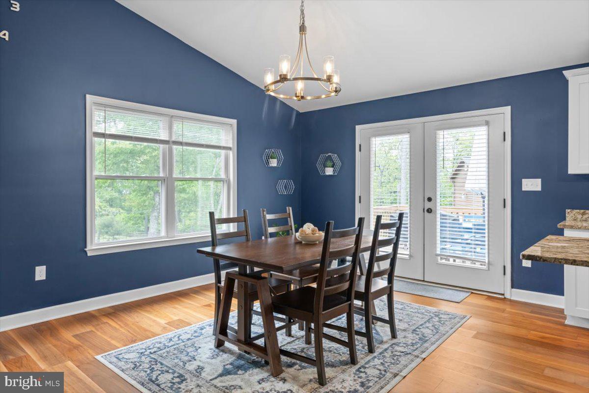 106 Split Rail Road Front Royal, VA 22630 - Photo 12 of 35 a view of a dining room with furniture window and wooden floor