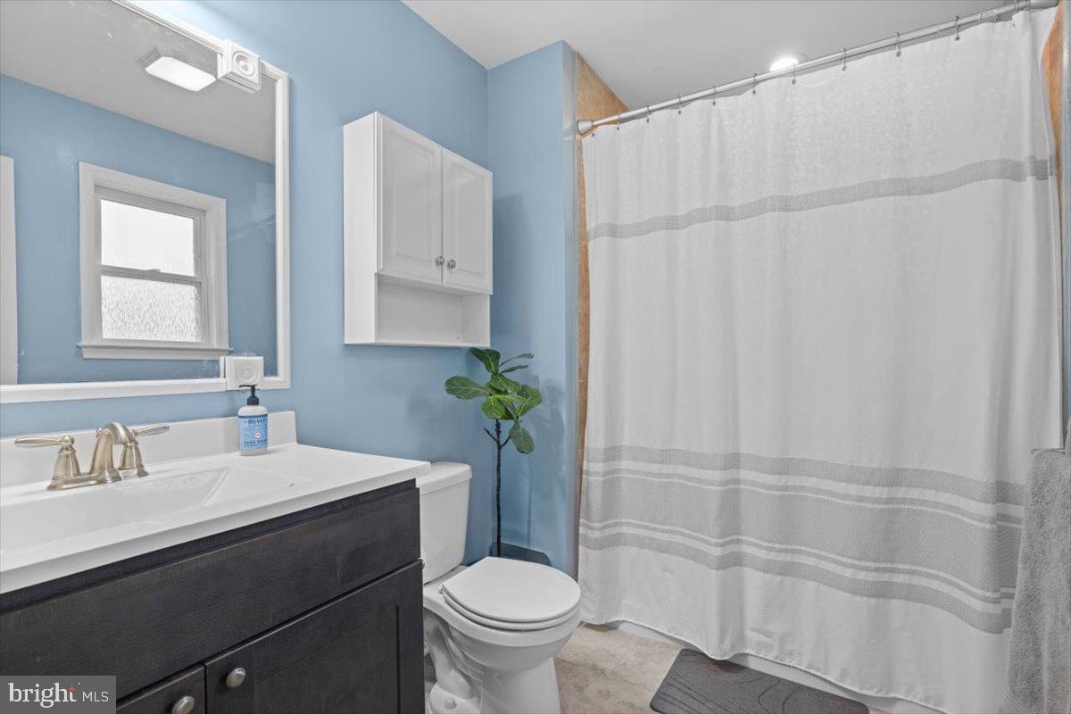 106 Split Rail Road Front Royal, VA 22630 - Photo 16 of 35 a bathroom with a sink toilet and shower