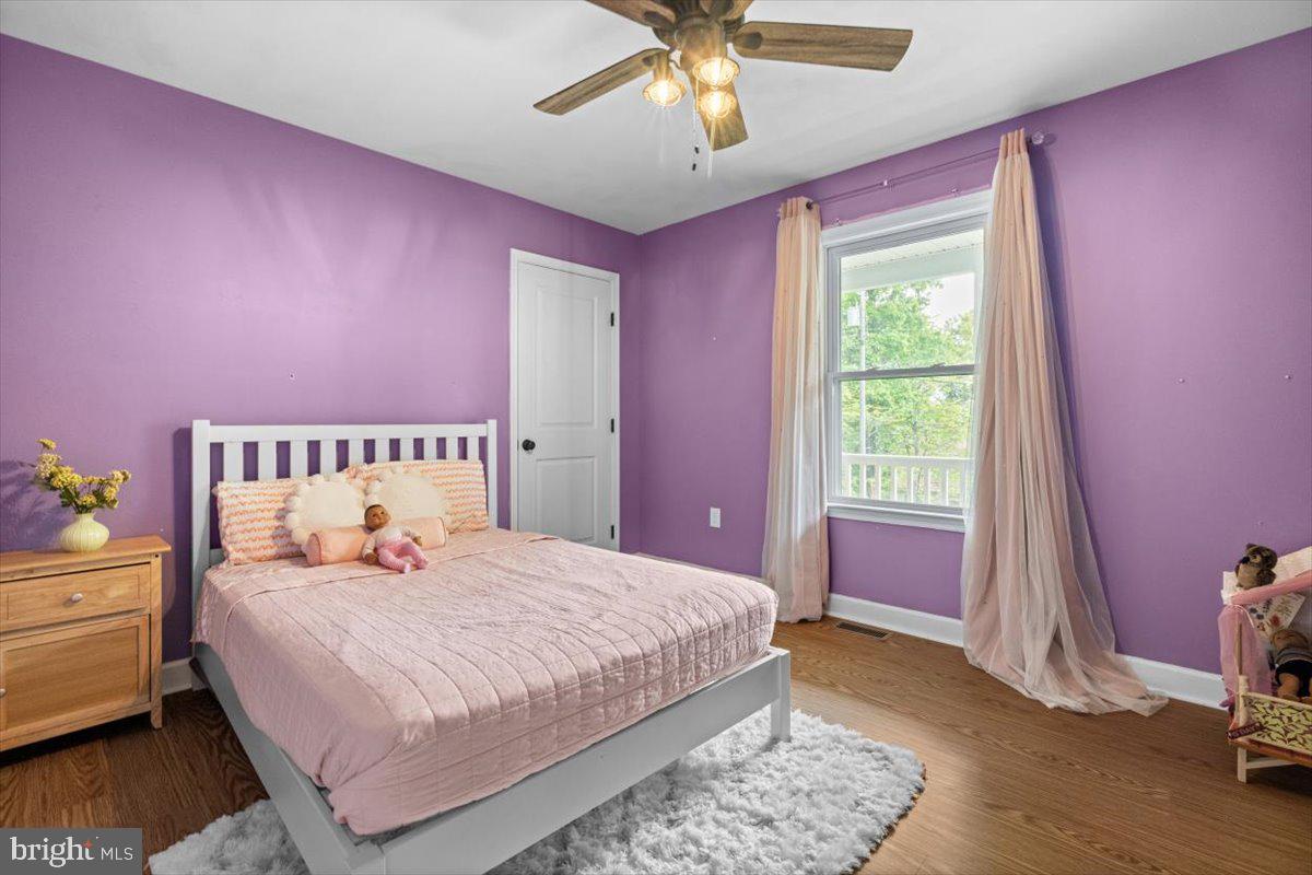 106 Split Rail Road Front Royal, VA 22630 - Photo 19 of 35 a bedroom with a bed and a window