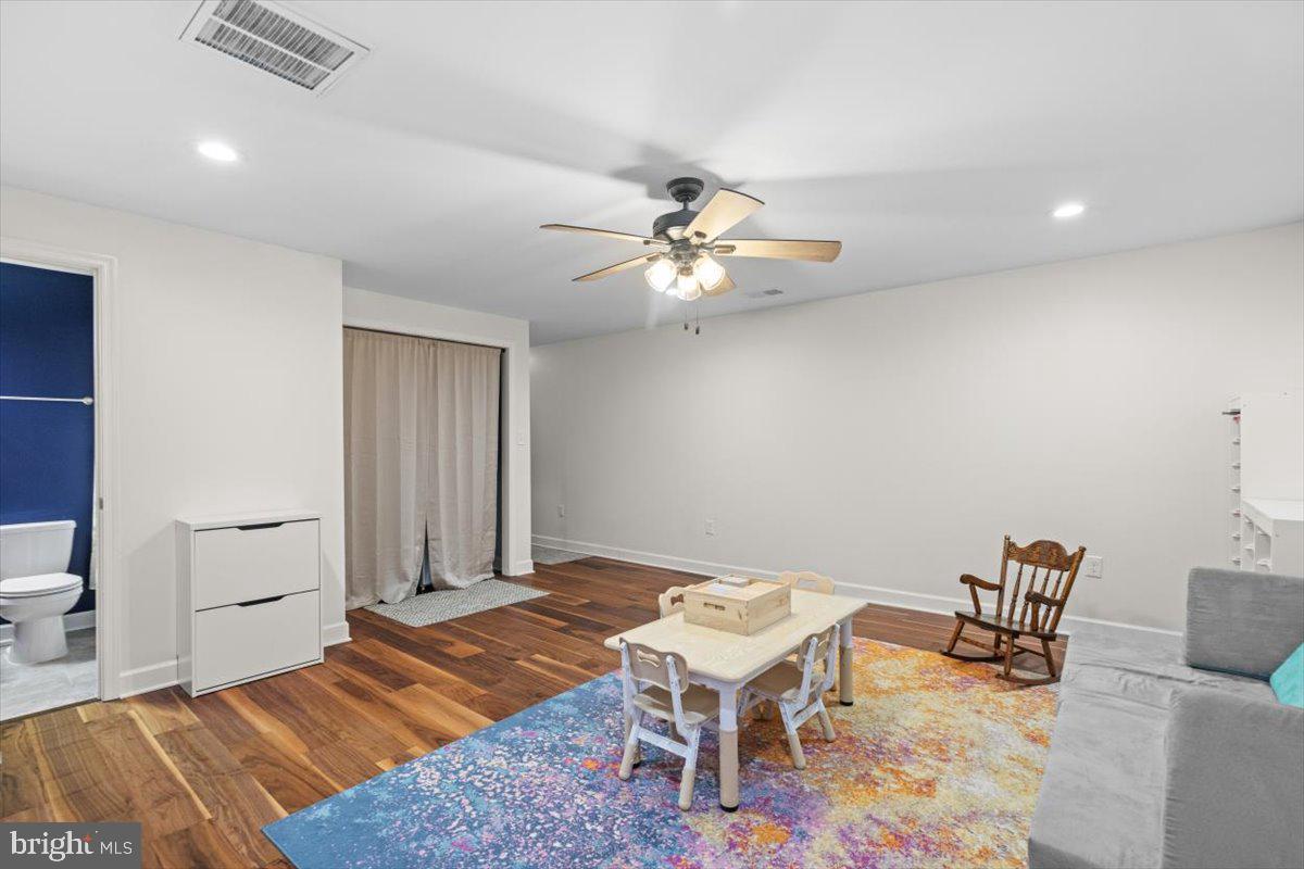106 Split Rail Road Front Royal, VA 22630 - Photo 20 of 35 a bedroom with a bed and a chandelier