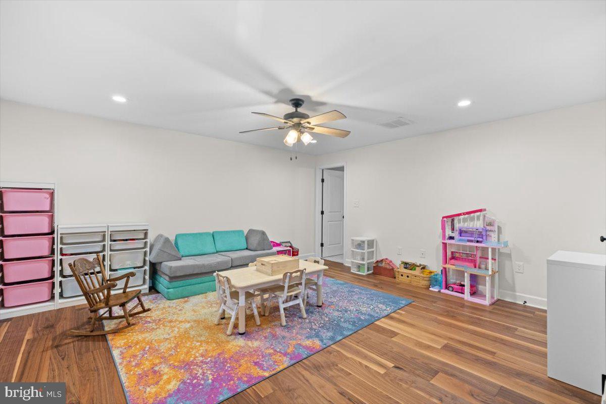 106 Split Rail Road Front Royal, VA 22630 - Photo 21 of 35 a living room with furniture and a chandelier