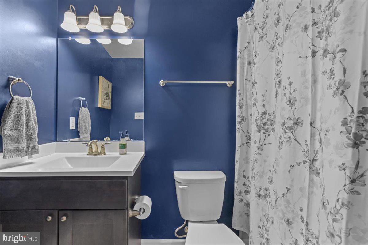 106 Split Rail Road Front Royal, VA 22630 - Photo 22 of 35 a bathroom with a toilet sink and mirror