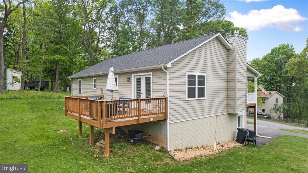 106 Split Rail Road Front Royal, VA 22630 - Photo 28 of 35 a white house that has a small yard and large trees