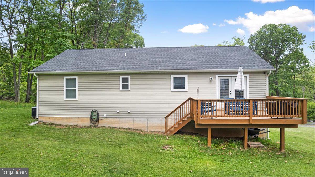 106 Split Rail Road Front Royal, VA 22630 - Photo 29 of 35 a backyard of a house with a garden and deck
