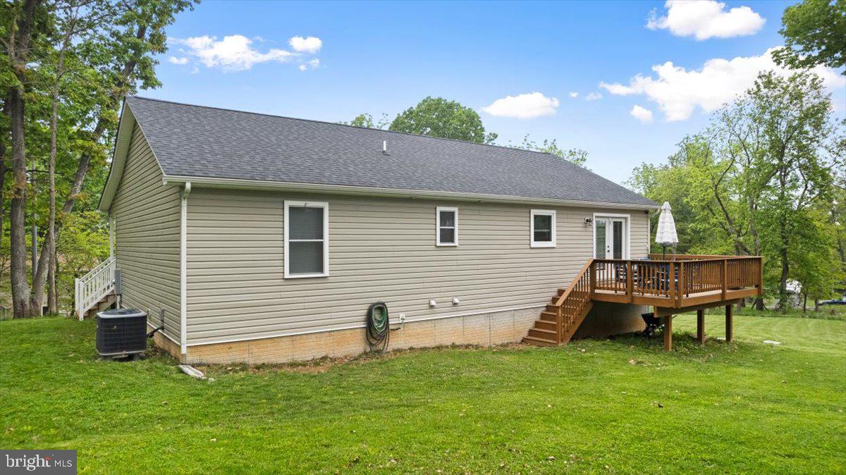 106 Split Rail Road Front Royal, VA 22630 - Photo 30 of 35 a backyard of a house with table and chairs