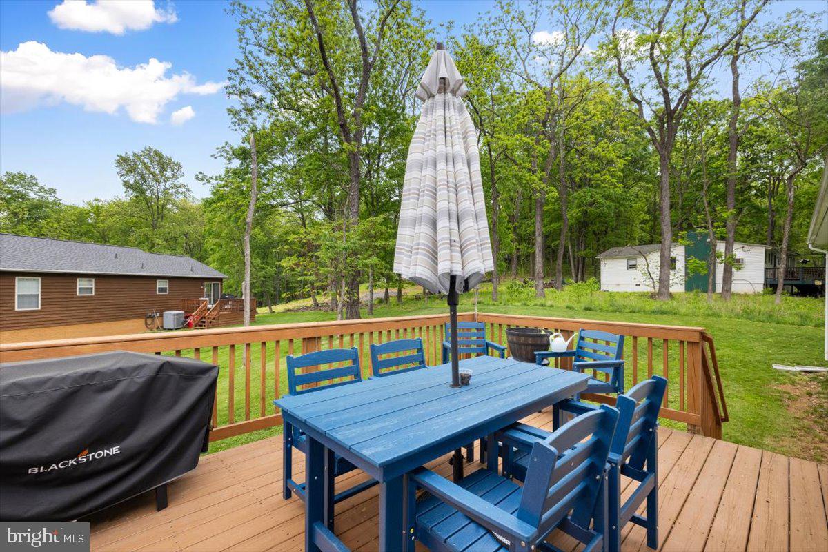 106 Split Rail Road Front Royal, VA 22630 - Photo 3 of 35 a view of deck with furniture and barbeque oven