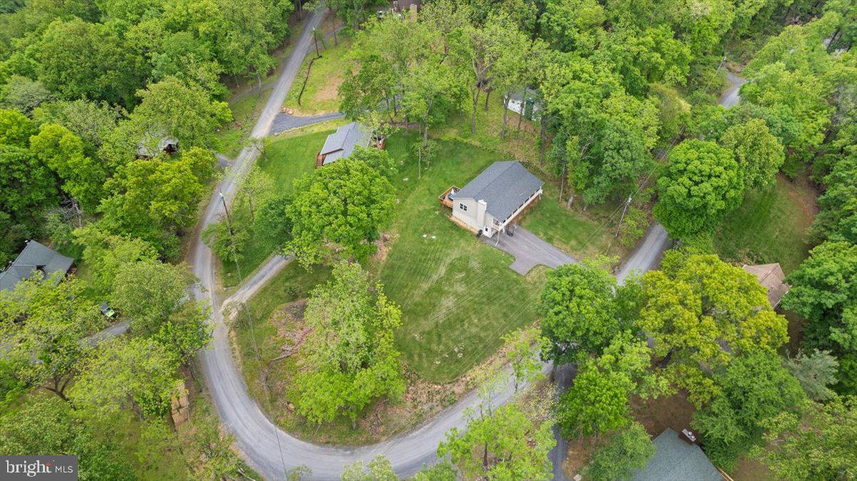 106 Split Rail Road Front Royal, VA 22630 - Photo 33 of 35 an aerial view of a house with swimming pool and garden