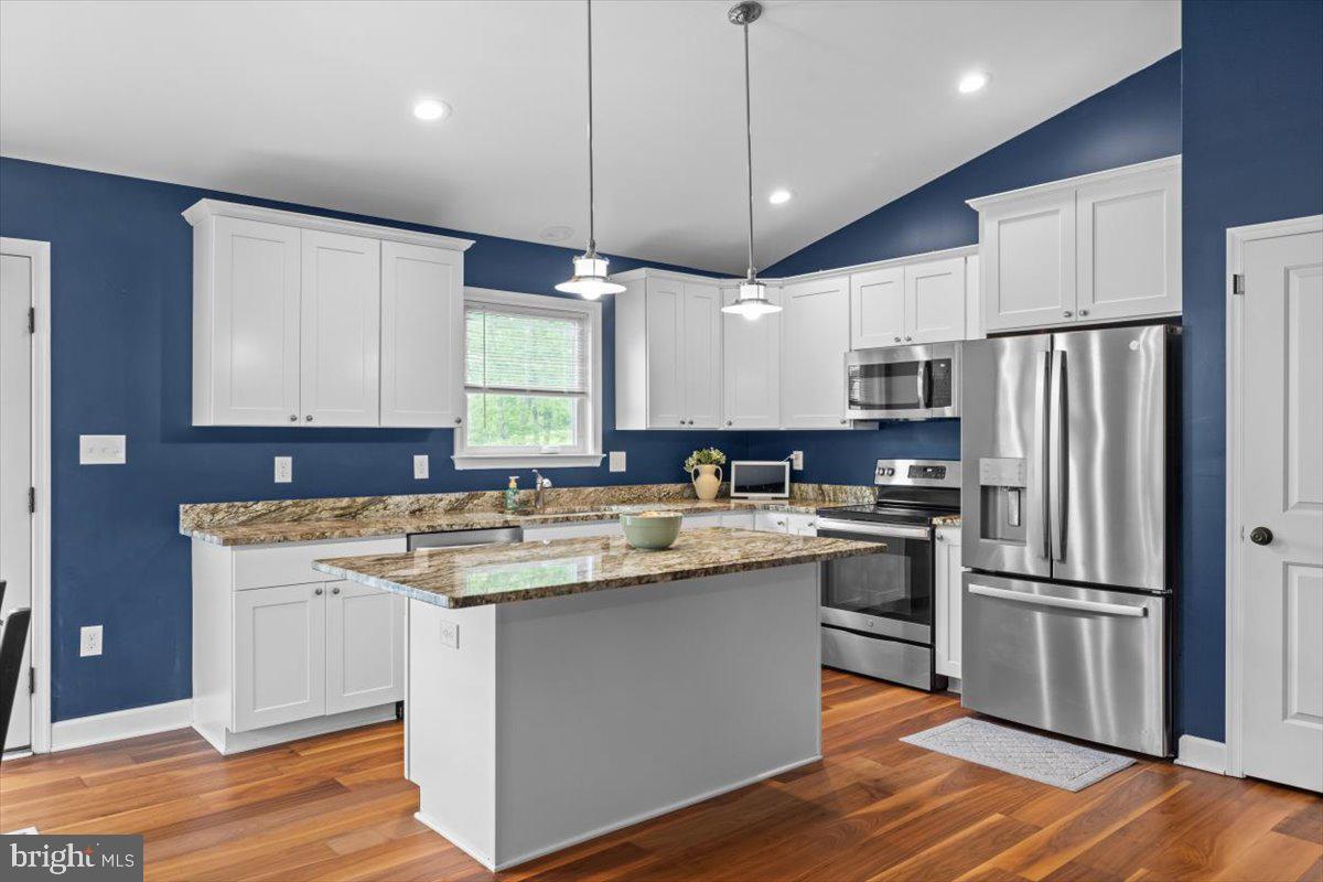 106 Split Rail Road Front Royal, VA 22630 - Photo 6 of 35 a kitchen with kitchen island granite countertop a sink appliances cabinets and counter space