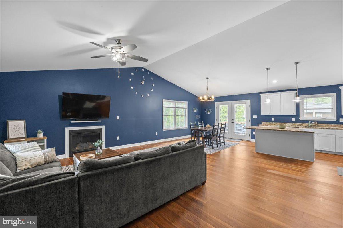 106 Split Rail Road Front Royal, VA 22630 - Photo 8 of 35 a living room with furniture a flat screen tv and kitchen view