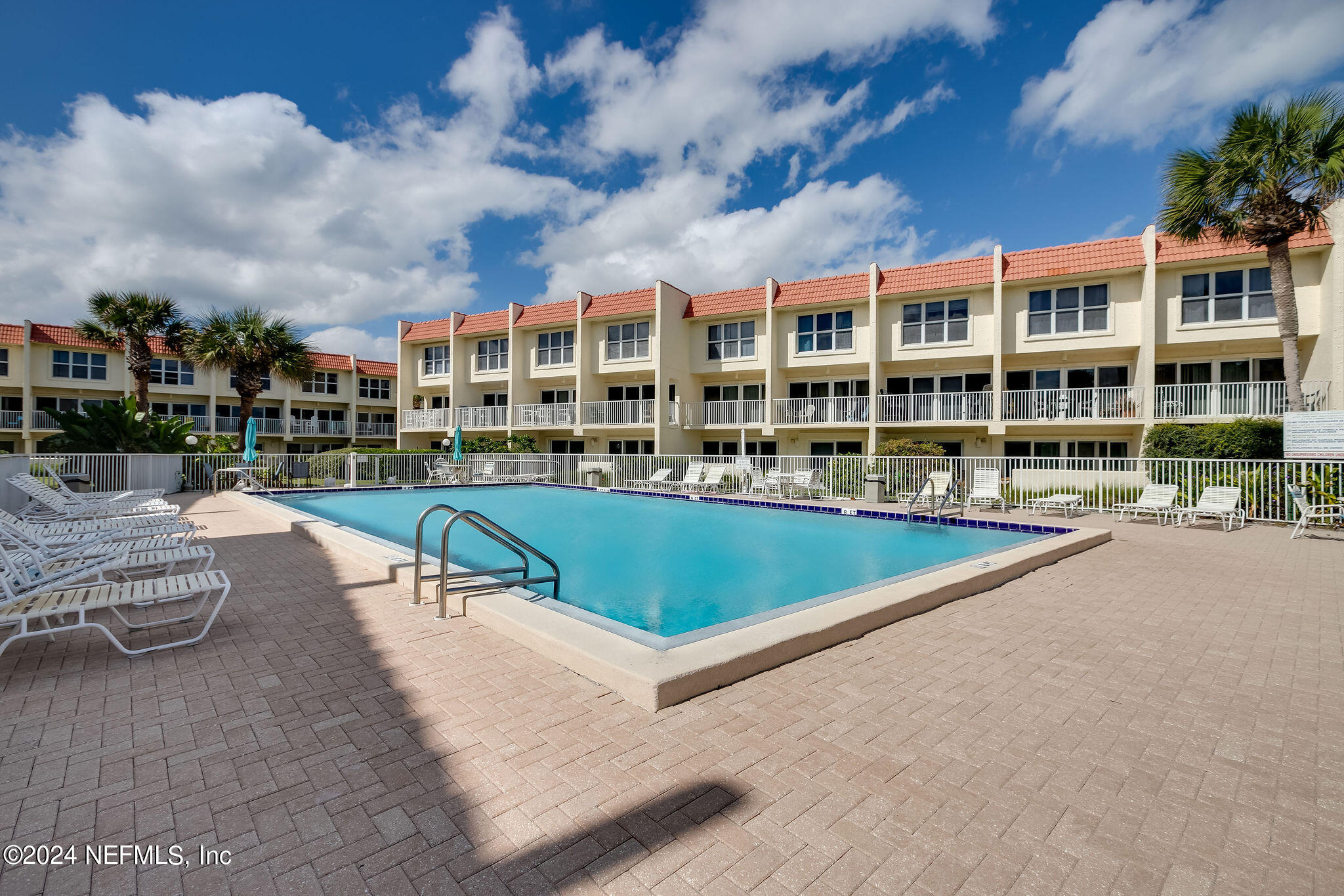 390 A1A Beach Boulevard, Unit 50 St. Augustine, FL 32080 - Photo 17 of 20 a view of pool with outdoor seating