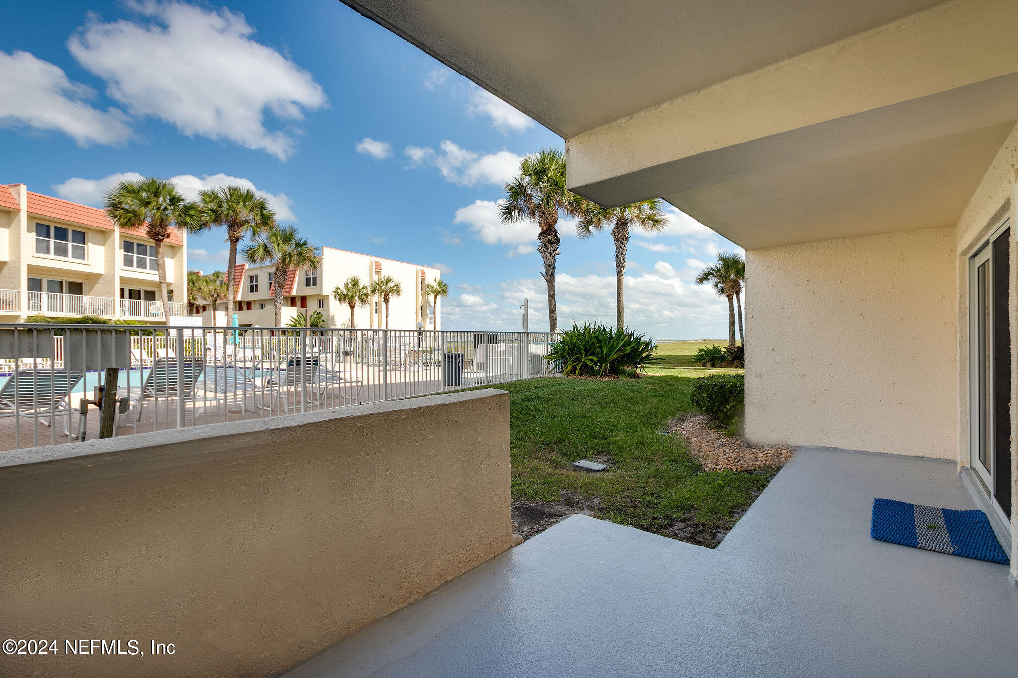 390 A1A Beach Boulevard, Unit 50 St. Augustine, FL 32080 - Photo 3 of 20 a view of swimming pool from a balcony