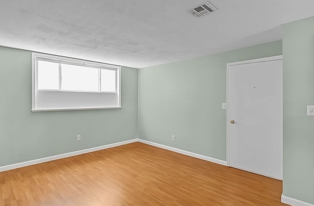 5455 North Main Street, Unit 14B Fall River, MA 02720 - Photo 2 of 8 a view of empty room with wooden floor and fan