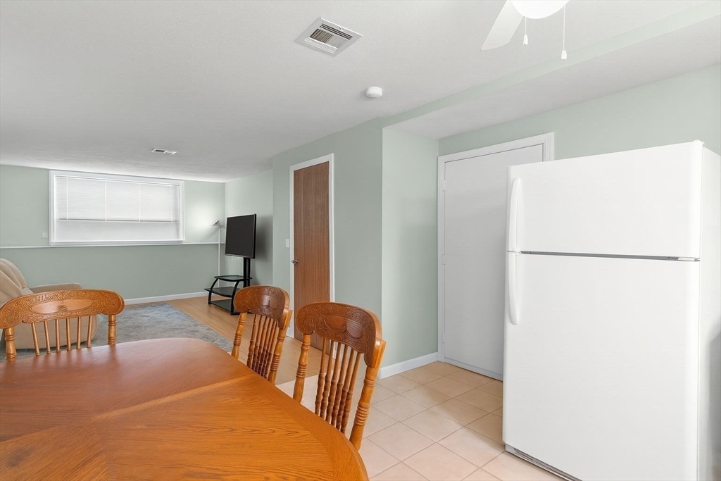 5455 North Main Street, Unit 14B Fall River, MA 02720 - Photo 3 of 8 a bedroom with furniture and a rug