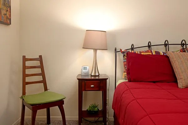 a bedroom with a bed and a window