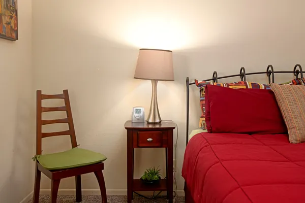 a bedroom with a bed and a window