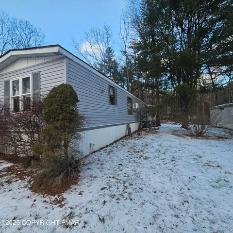 a living room with furniture a rug and a fireplace