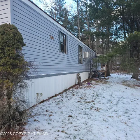 a kitchen with stainless steel appliances granite countertop a stove a sink a dining table and chairs