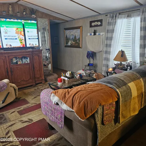 a room with furniture and a flat screen tv