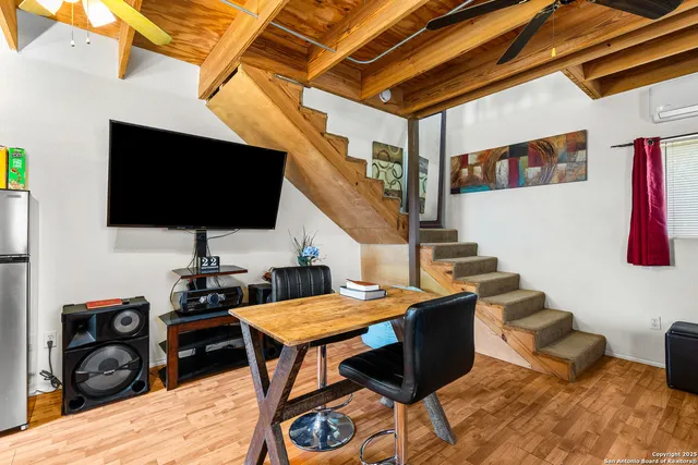 a livingroom with furniture and a flat screen tv
