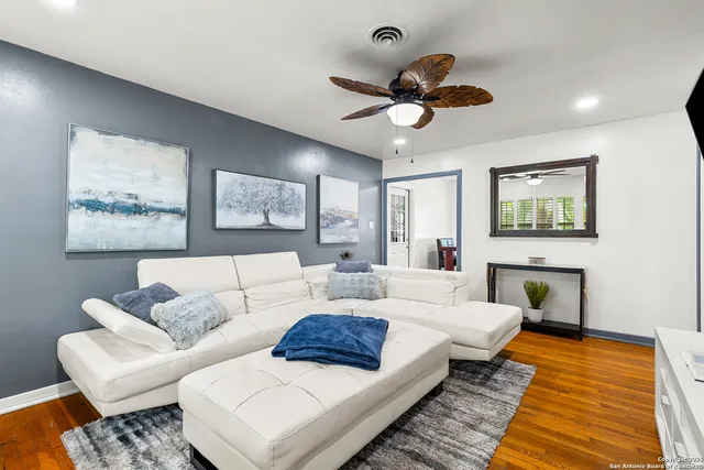 a living room with furniture and a rug