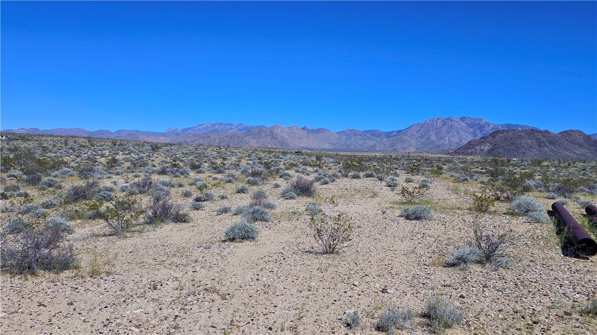 208-21-166 South Akchin Road Yucca, AZ 86438 - Photo 12 of 16 a view of a road with mountains in the background