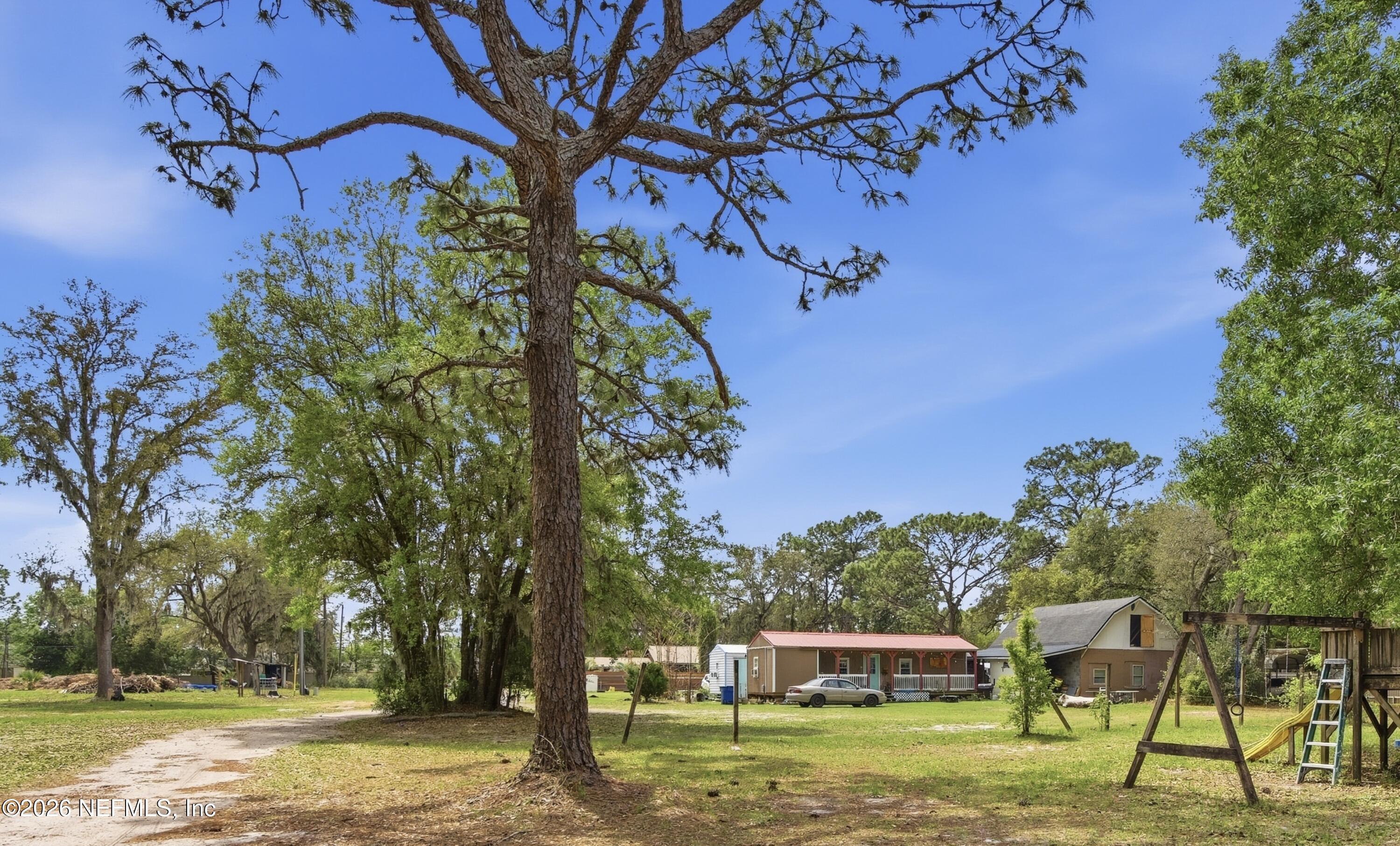 4111 Cedar Point Road Jacksonville, FL 32226 - Photo 4 of 14 a front view of a house with a yard
