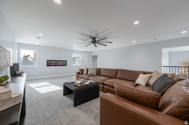 476 Spring Drive Toquerville, UT 84774 - Photo 33 of 95 Living area with carpet, ceiling fan, recessed lighting, and a glass covered fireplace