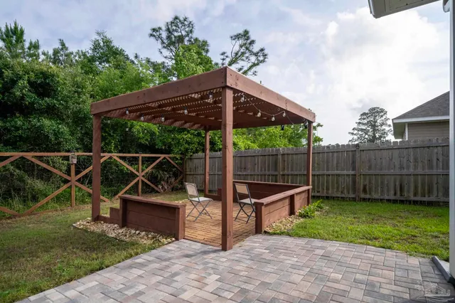 a view of a chair and table in the garden