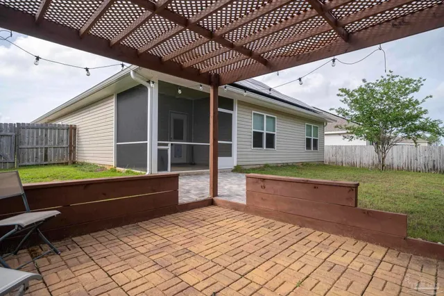 a swimming pool with outdoor seating