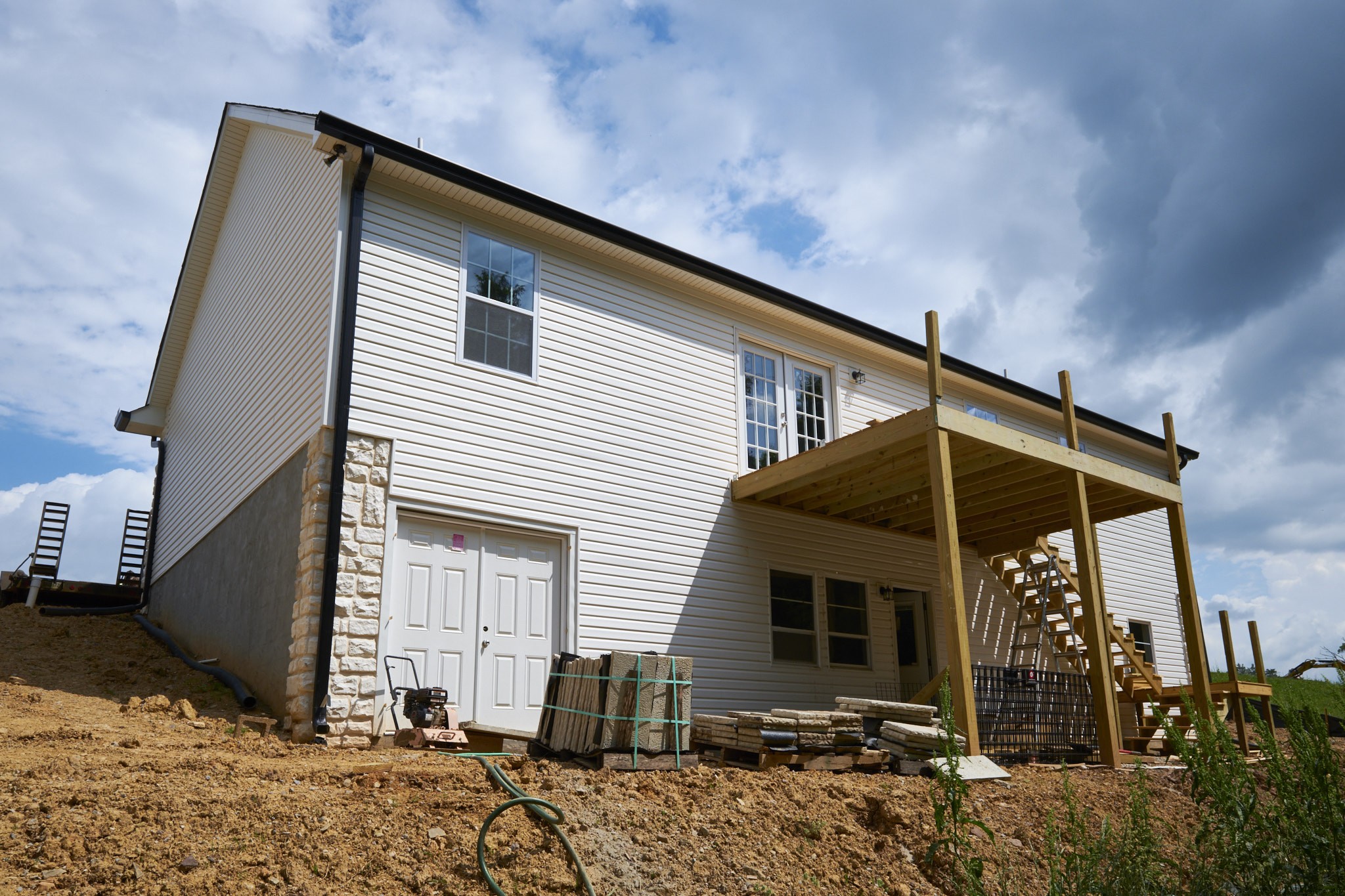 5320 Golden Eagle Lane Corryton, TN 37721 - Photo 23 of 27 a backyard of a house with barbeque oven table and chairs