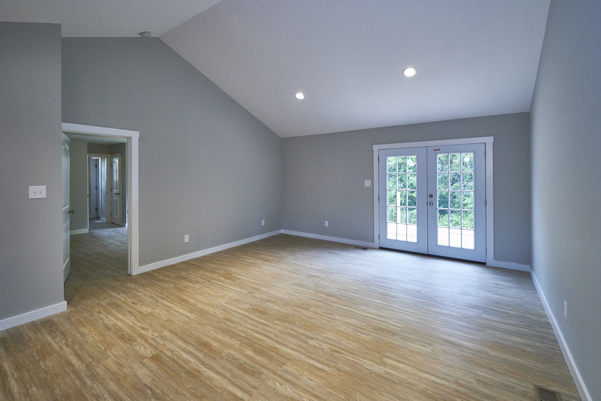 5320 Golden Eagle Lane Corryton, TN 37721 - Photo 6 of 27 a view of a big room with wooden floor and windows