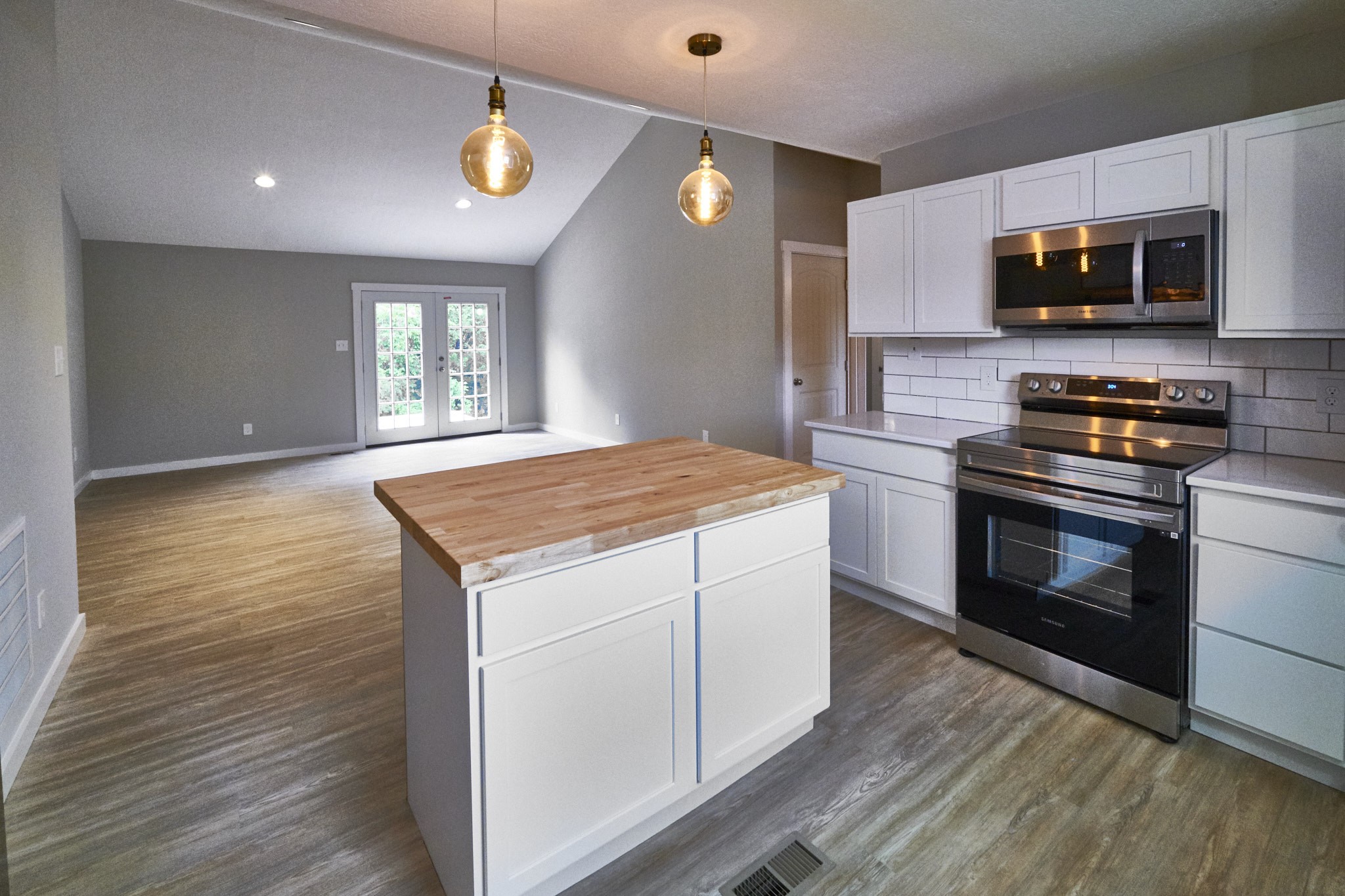 5320 Golden Eagle Lane Corryton, TN 37721 - Photo 8 of 27 a kitchen with a stove and a microwave