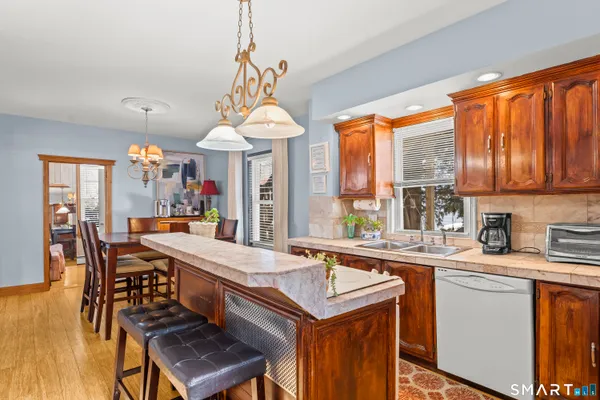 a dining table with chairs and window