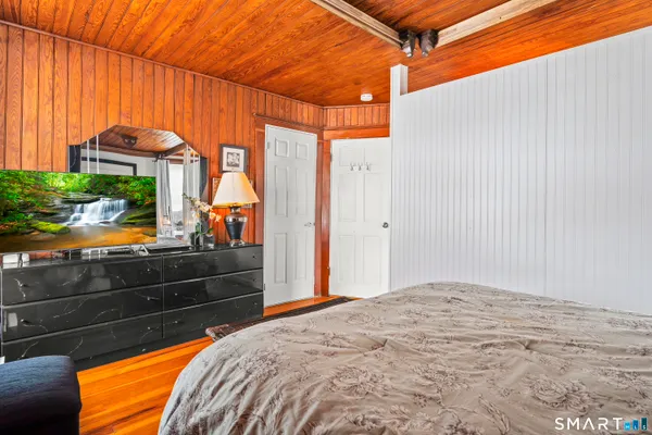 a bedroom with a bed and a dresser