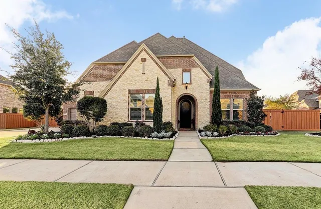 a front view of a house with yard