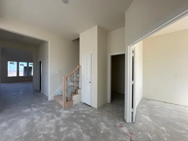 a view of an empty room with a fireplace