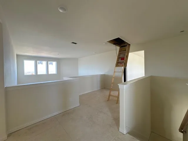 an empty room with windows