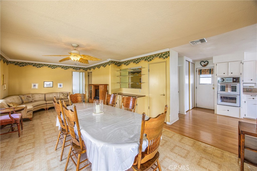 41238 Cheyenne Trail Cherry Valley, CA 92223 - Photo 14 of 44 a view of a living room and kitchen