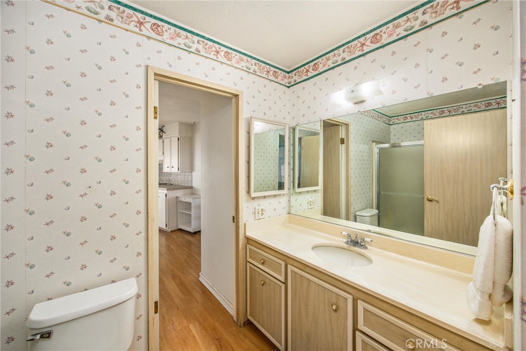 41238 Cheyenne Trail Cherry Valley, CA 92223 - Photo 20 of 44 a bathroom with a double vanity sink toilet and shower