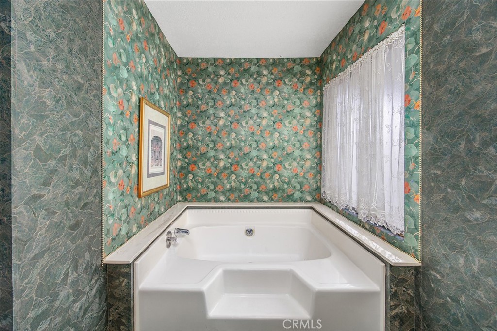 41238 Cheyenne Trail Cherry Valley, CA 92223 - Photo 25 of 44 a bathroom with a sink and a bathtub