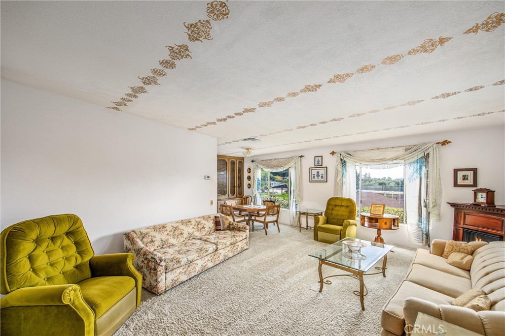 41238 Cheyenne Trail Cherry Valley, CA 92223 - Photo 5 of 44 a living room with furniture and a large window