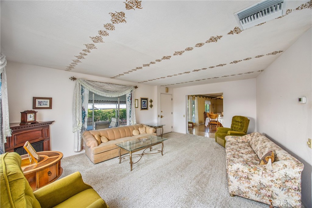 41238 Cheyenne Trail Cherry Valley, CA 92223 - Photo 7 of 44 a living room with furniture and a flat screen tv