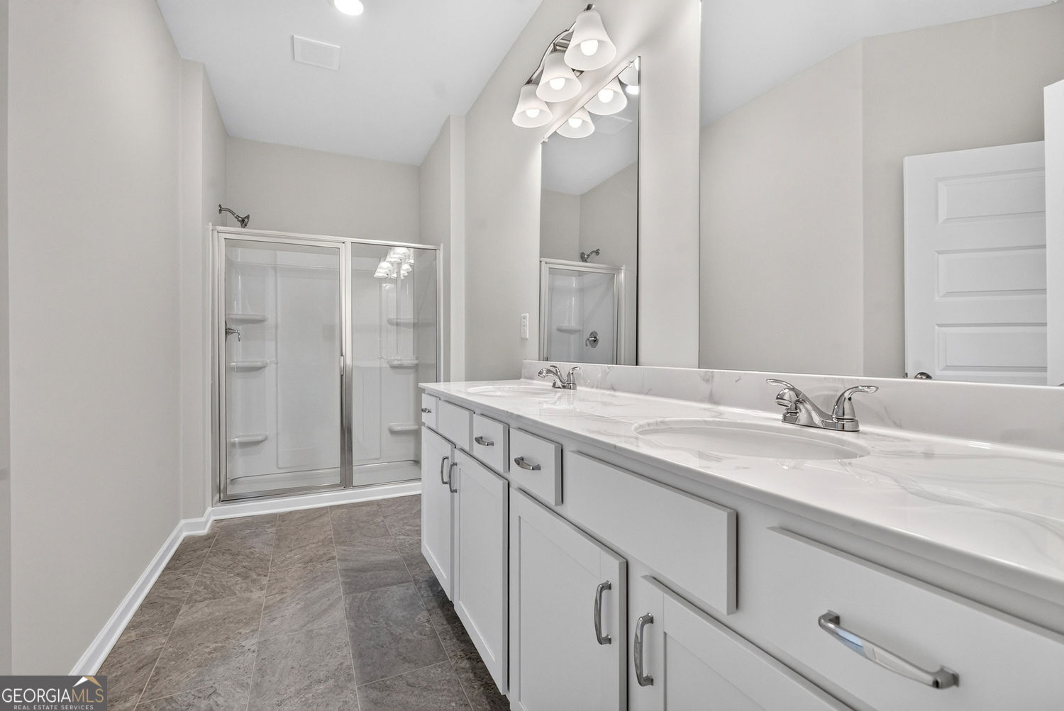 155 Oconee Road, Unit 252 Cartersville, GA 30120 - Photo 38 of 39 a spacious bathroom with a granite countertop sink a mirror and shower