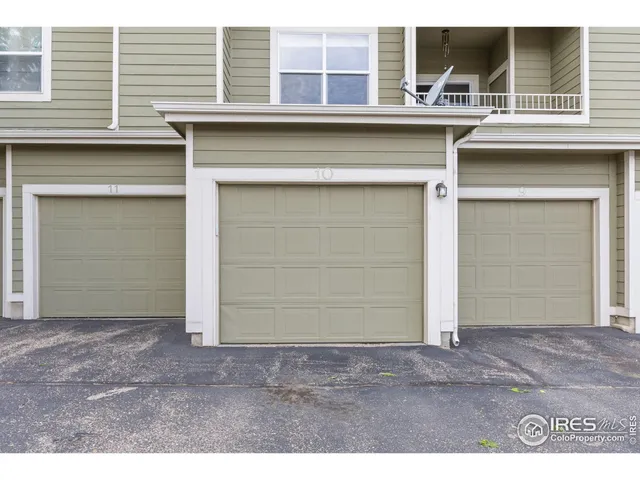 a view of a house with a parking space