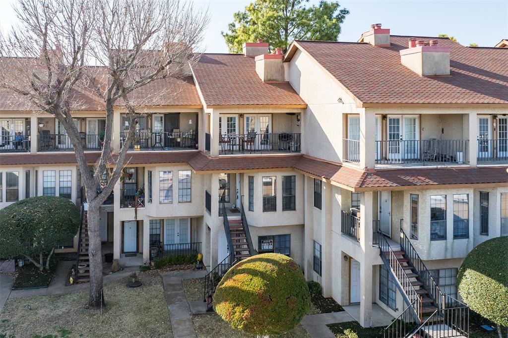1933 Island Circle, Unit B209 Tool, TX 75143 - Photo 1 of 30 a front view of a residential apartment building with a yard