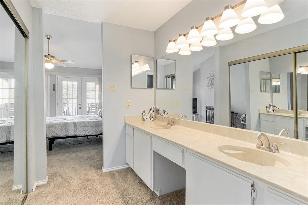 1933 Island Circle, Unit B209 Tool, TX 75143 - Photo 19 of 30 a spacious bathroom with a tub sink and mirror
