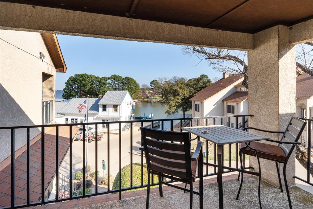1933 Island Circle, Unit B209 Tool, TX 75143 - Photo 23 of 30 a view of a balcony with furniture